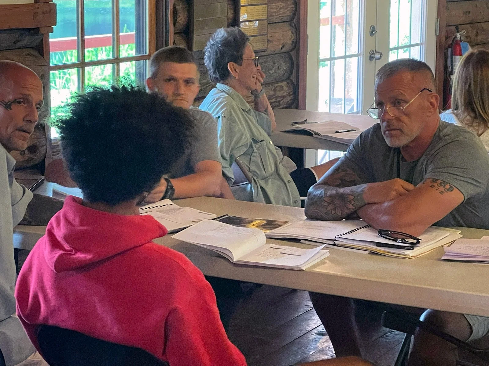 Guests and staff in a group session at Redemption House